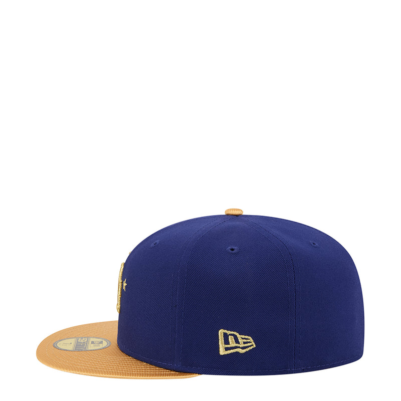 Navy baseball cap with gold New Era logo on the back