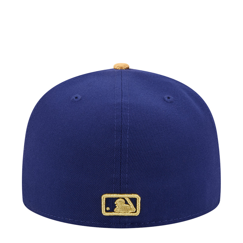 Navy baseball cap with gold MLB batter patch on the back