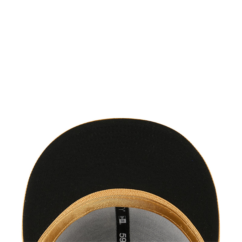 Black cap interior close-up with gold stitched trim edge