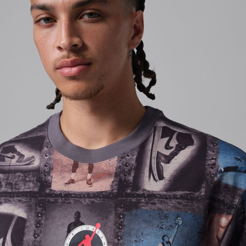 Men's graphic T-shirt crew neck close-up, dark collage squares with blue figures and red mark