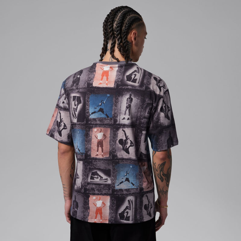 Men's graphic T-shirt back view with dark collage print and short sleeves
