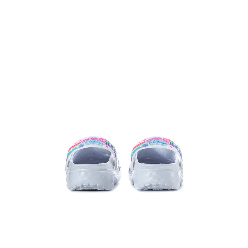 Kids slip-on clogs rear view, white with rainbow trim around openings
