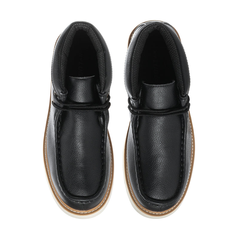 Pair of men's black leather chukka boots, top view of laces and padded collar