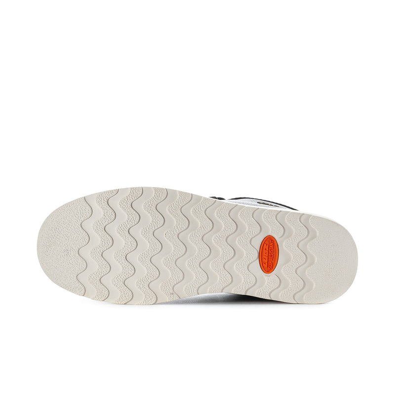 Men's black chukka boot outsole, textured tread with orange Lugz mark