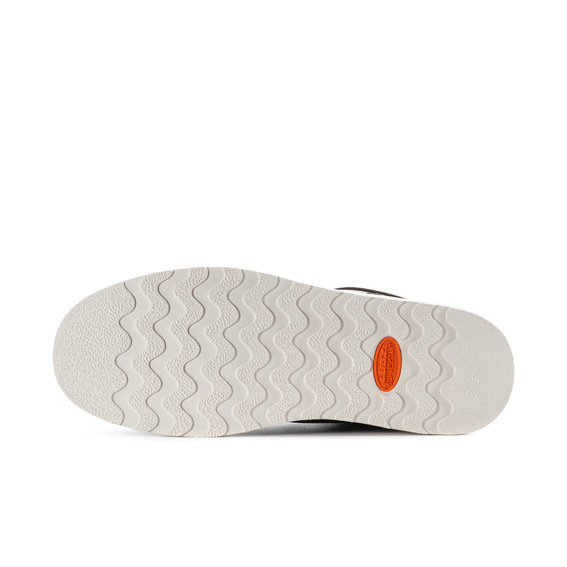 Men's boot outsole, textured light sole with orange brand badge