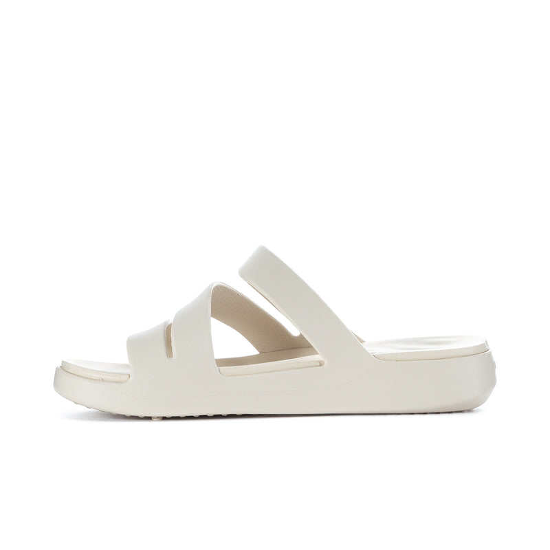 Women’s light beige strappy slide sandal shown from the side