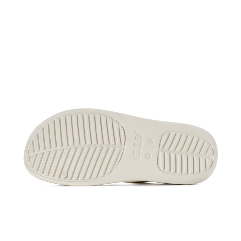 Women’s light beige sandal outsole with textured tread pattern