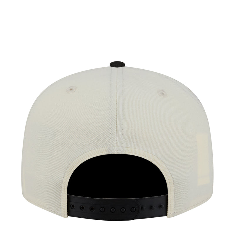 Two-tone snapback cap back view in white with black underside and adjustable strap