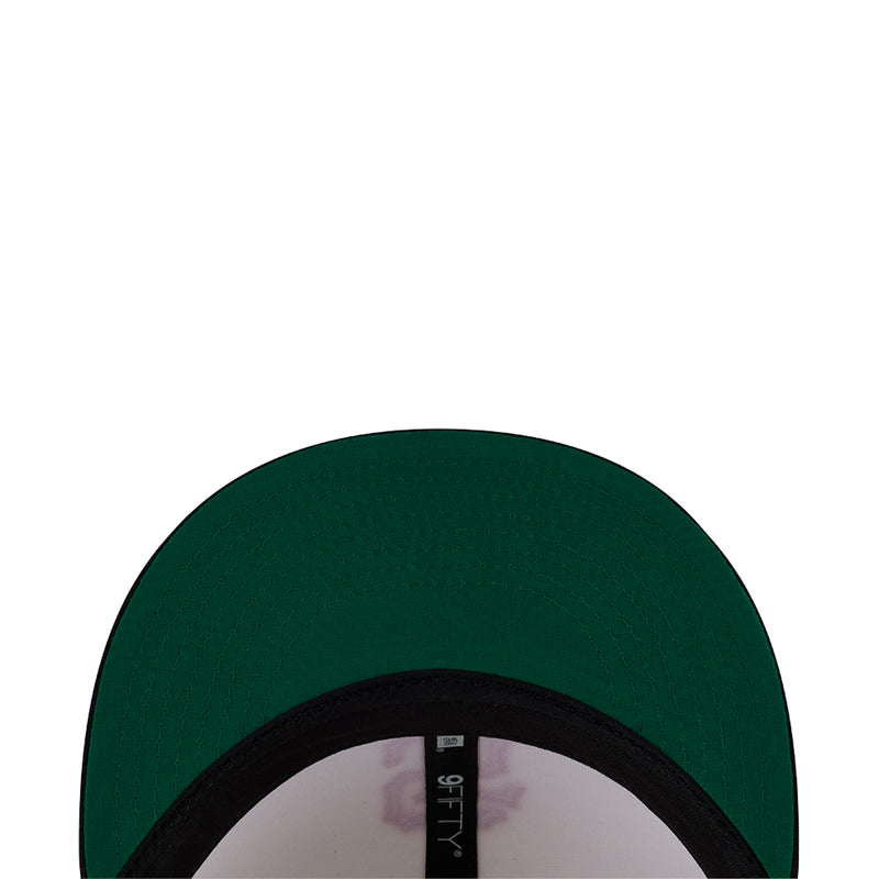 Two-tone snapback cap with dark green crown panel and black brim edge