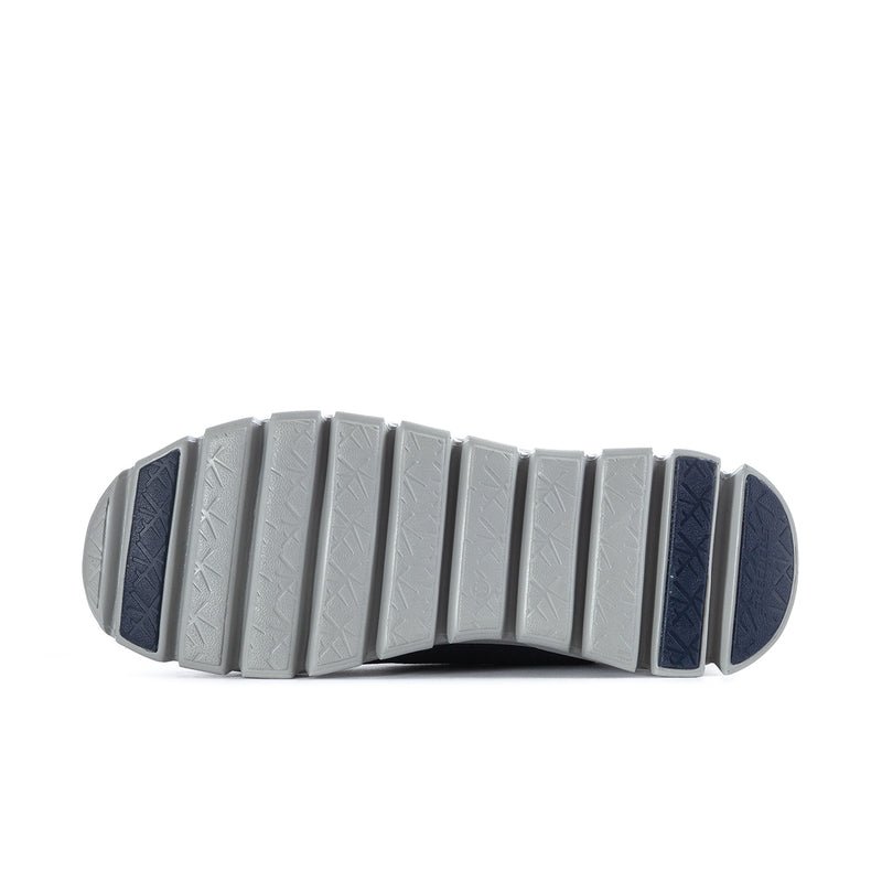 Navy sneaker outsole with white traction segments and pod-style cushioning