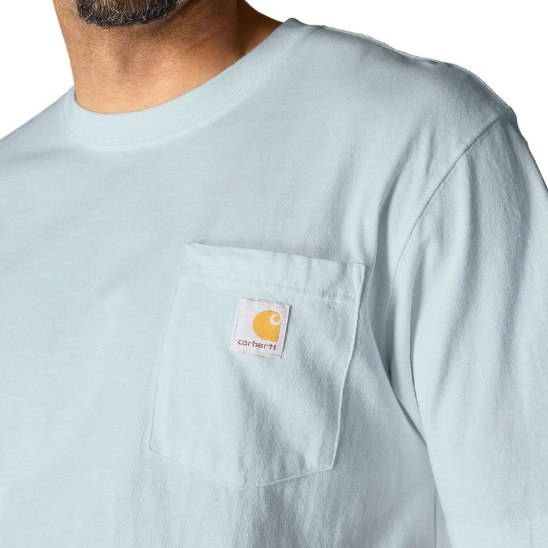 Light blue T-shirt with chest pocket and logo patch, crew neck.