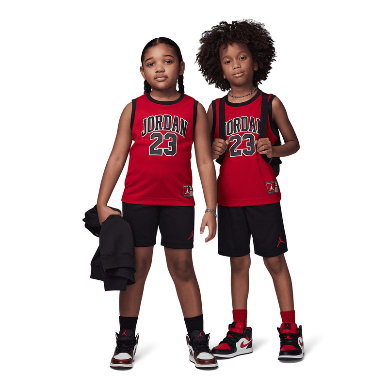 Kids' Jordan jersey set on two children: red “Jordan 23” tops with black shorts