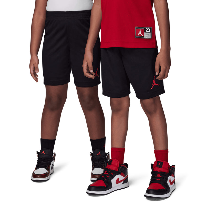 Kids' black shorts paired with red sleeveless “Jordan 23” jersey