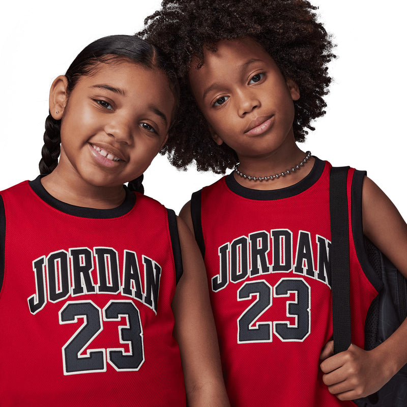 Kids' Jordan red sleeveless jerseys showing “JORDAN 23” front design