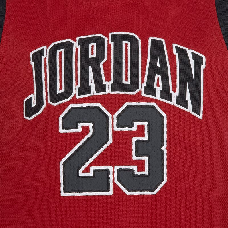 Red sleeveless jersey with large “JORDAN 23” graphic