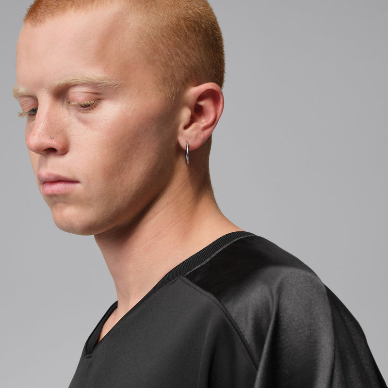 Men's black jersey neckline and shoulder with subtle Jordan emblem