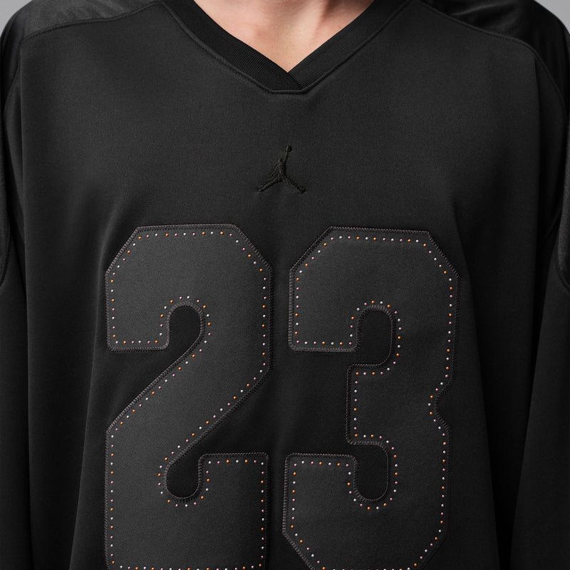 Men's black jersey front close-up with stitched 23 number graphic