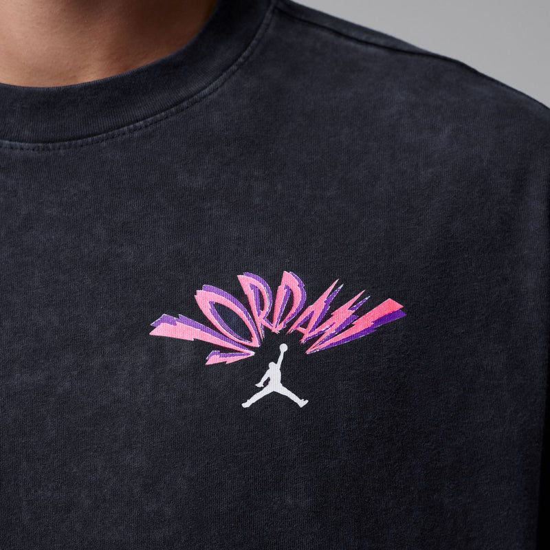Pink Jordan logo graphic on washed black crewneck T-shirt