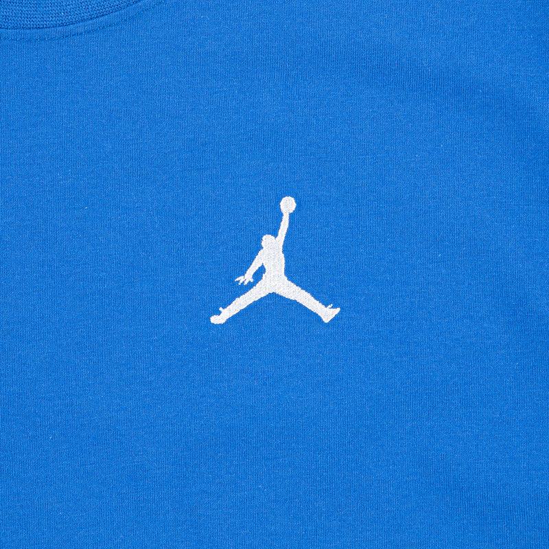 Sport blue youth tee closeup: white embroidered Jumpman silhouette