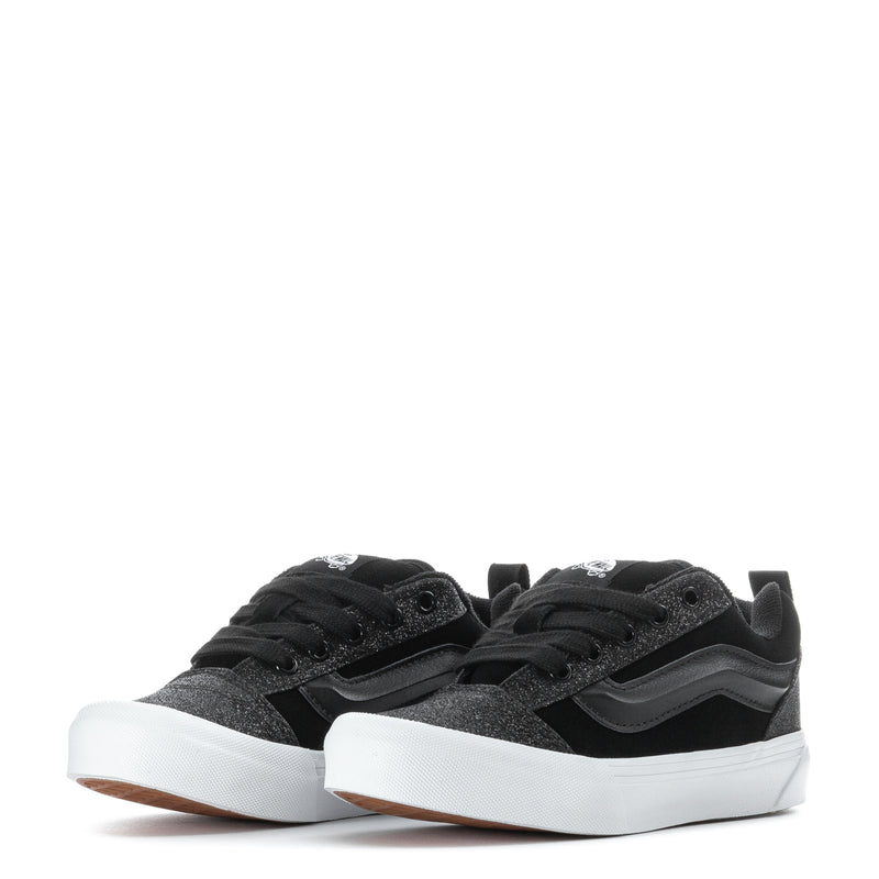 Pair of kids black glitter low-top sneakers with white soles