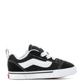 Toddler black and white sneakers, lace-up with white side stripe and low rubber sole