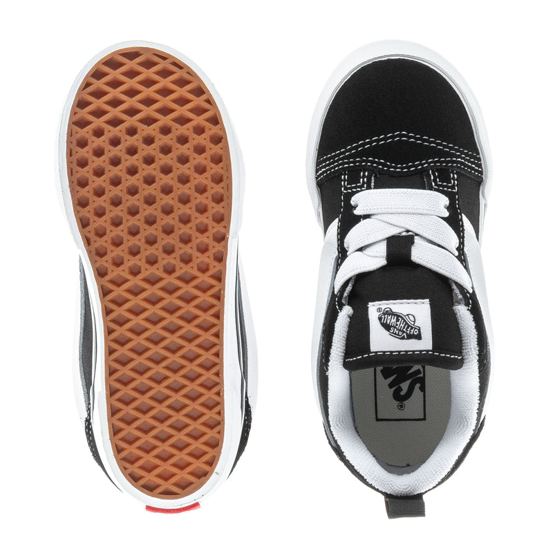 Toddler sneakers with brown rubber outsole and black-and-white inner lining