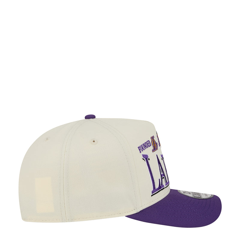 Cream baseball cap with purple under-brim and side Lakers logo