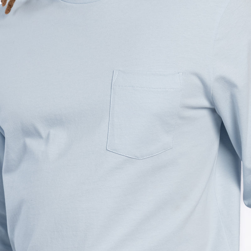 Sky blue long-sleeve work shirt chest pocket detail
