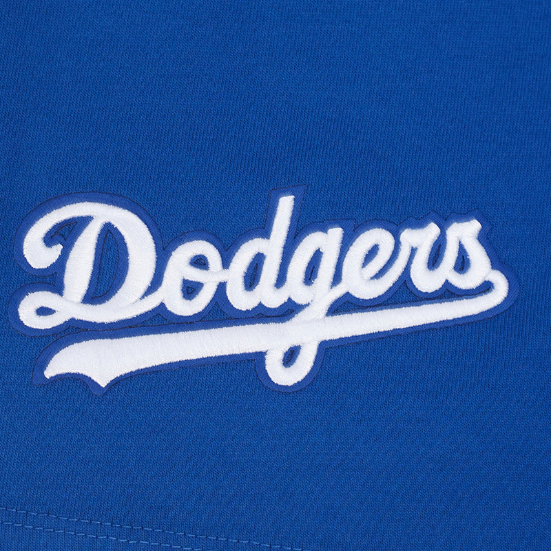 Close-up of blue T-shirt chest with white “Dodgers” script logo