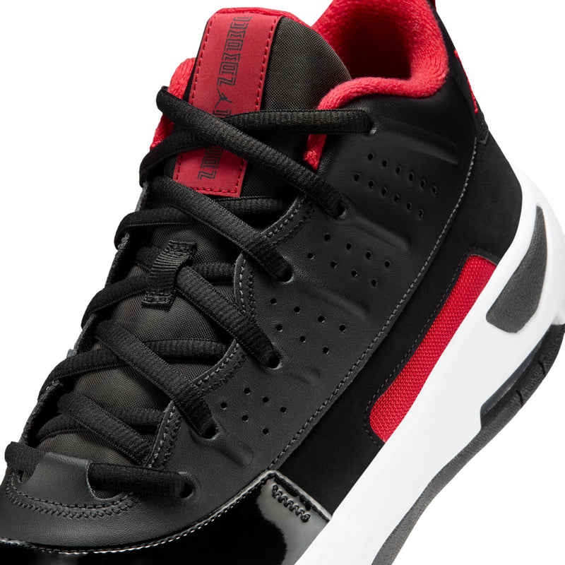 Men's black lace-up shoe close-up with red collar lining and red interior tongue label.