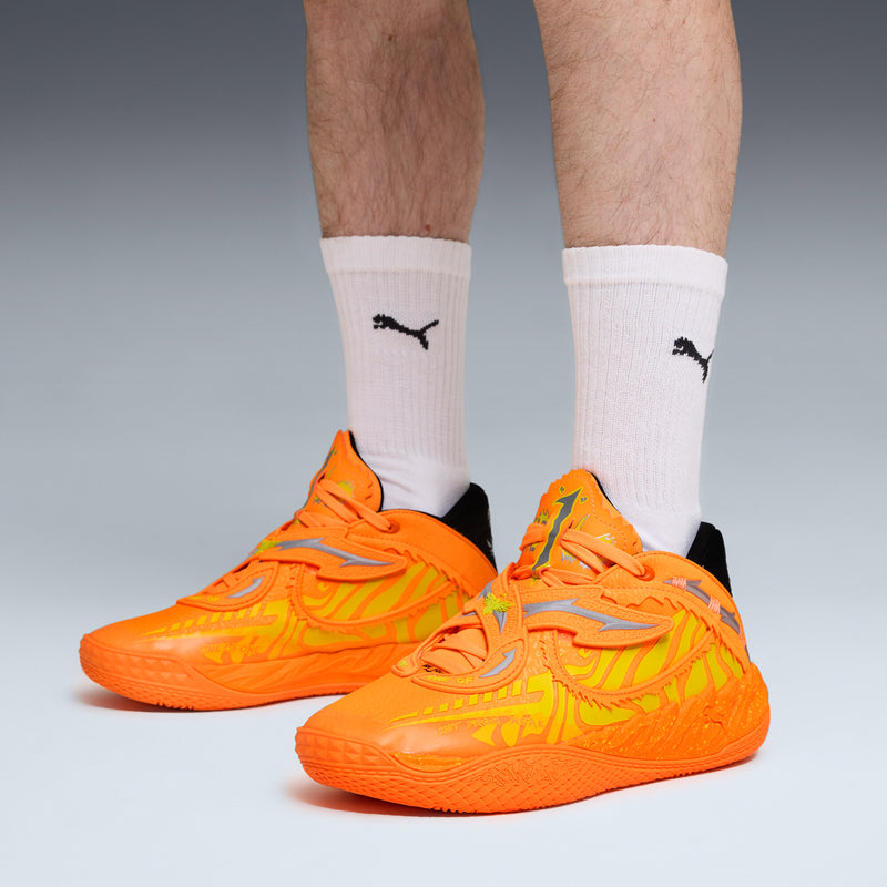 Pair of men's orange and yellow athletic sneakers with white logo socks