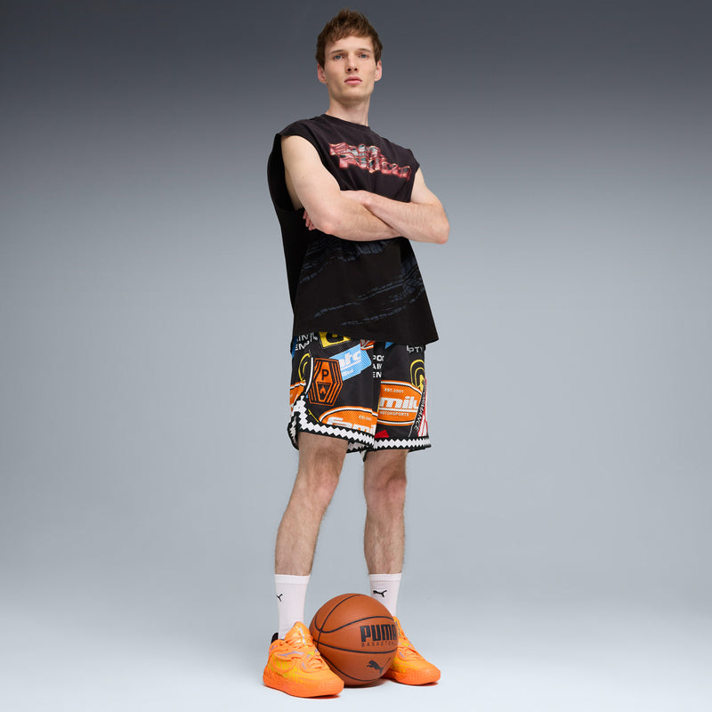 Men's orange and yellow sneakers worn with shorts and socks