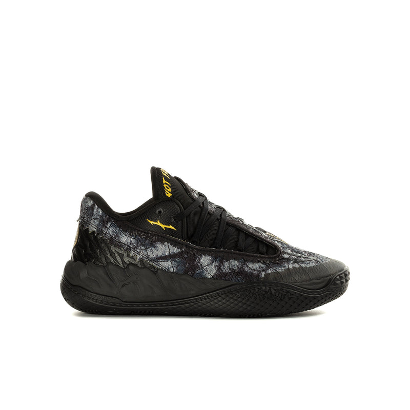 Youth black low-top sneaker with lace-up front and textured side panels, yellow logo