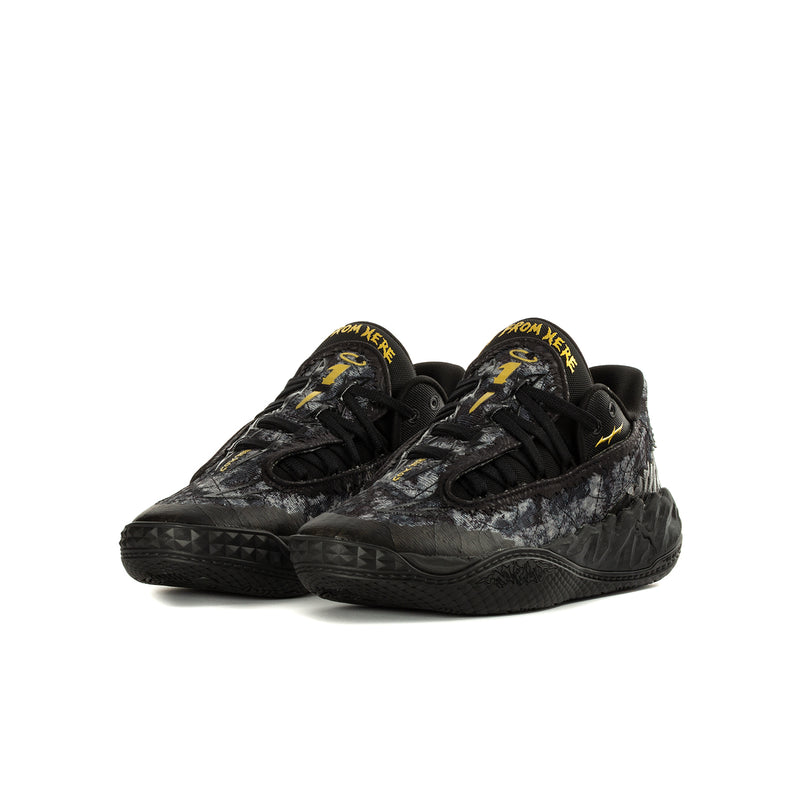 Youth black lace-up sneaker with speckled texture and yellow accent text on tongue