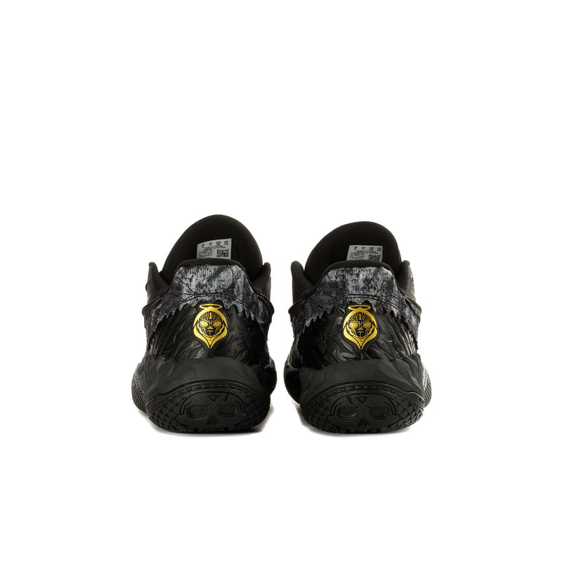 Youth black sneaker pair with gold emblem on heel and patterned side panels