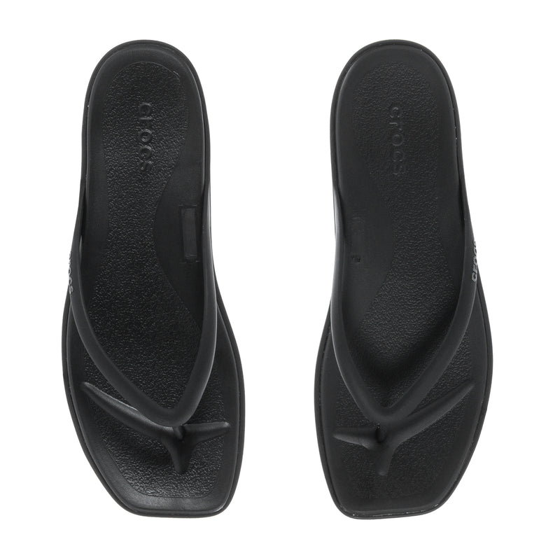 Women's black flip-flop sandals, top view of two textured footbeds