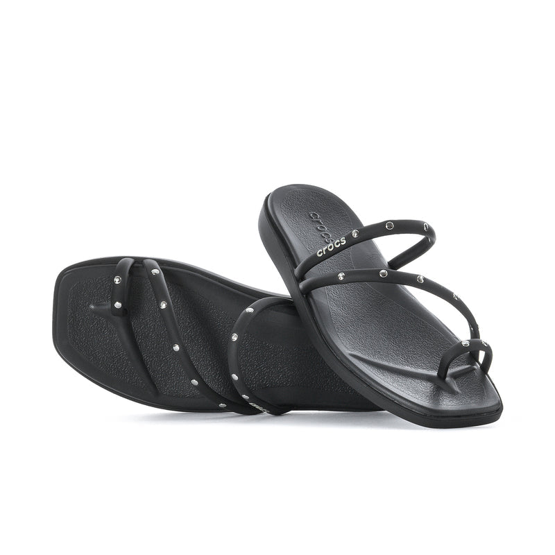 Black thong-style toe loop sandal with studded strap details, flat sole