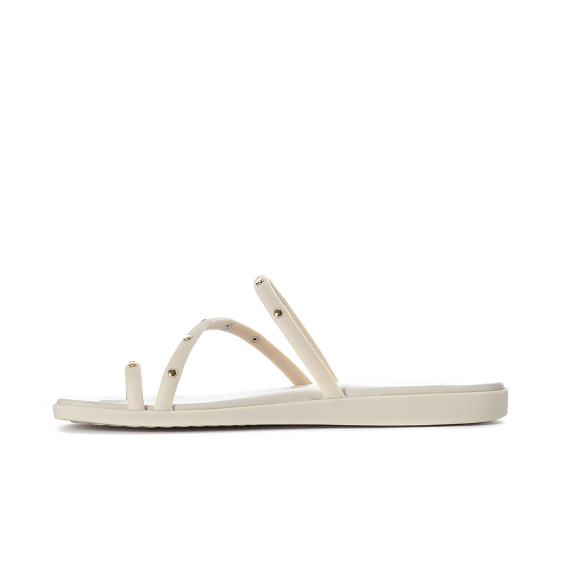 Women’s studded toe-loop sandals, side view with three light straps and sole