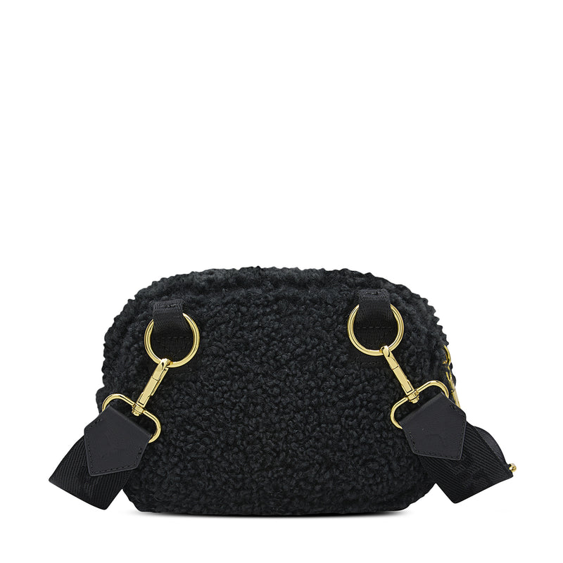 Black sherpa camera bag front with gold top rings and attached strap tabs