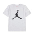 Youth heather T-shirt with large black Jumpman graphic and small red logo near collar