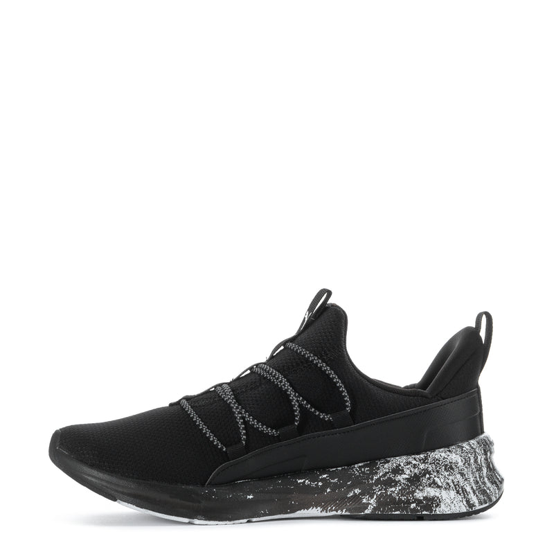Black youth sneaker, lace-up straps and white speckled sole with sculpted side