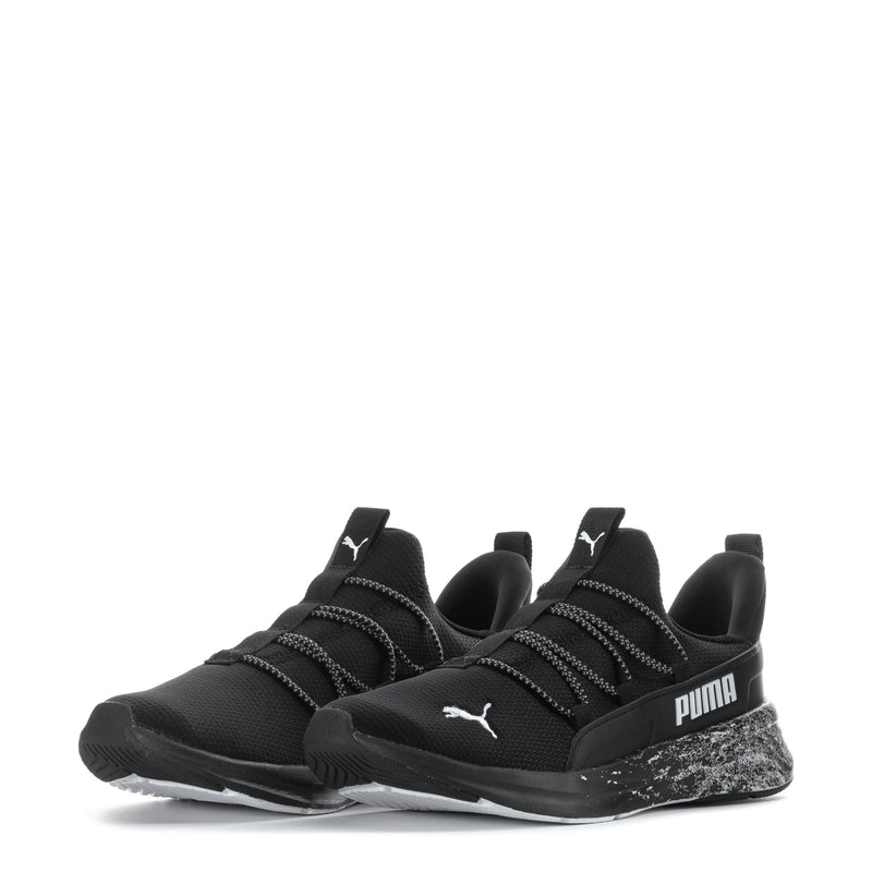 Black youth sneaker pair, lace-up design with PUMA logo and white speckled sole