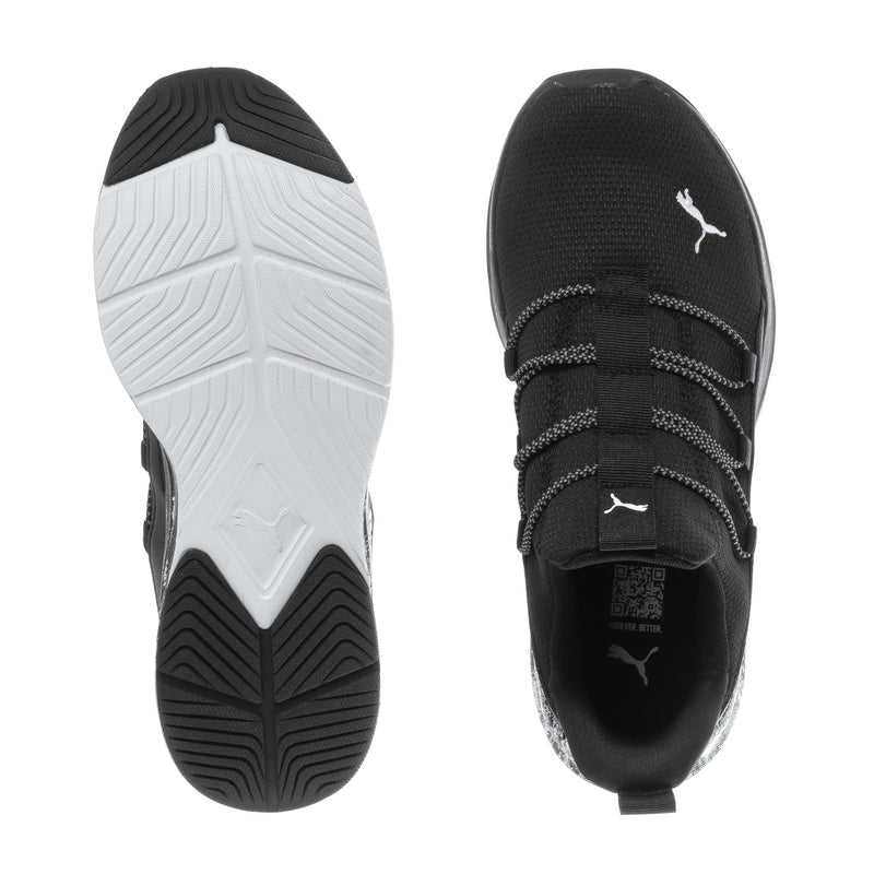 Black and white shoe sole view, tread on outsole and PUMA logo on upper