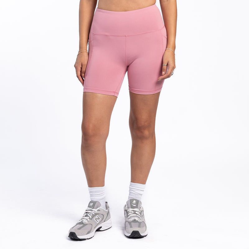 Women’s rose pink bike shorts, fitted mid-thigh length with side seams
