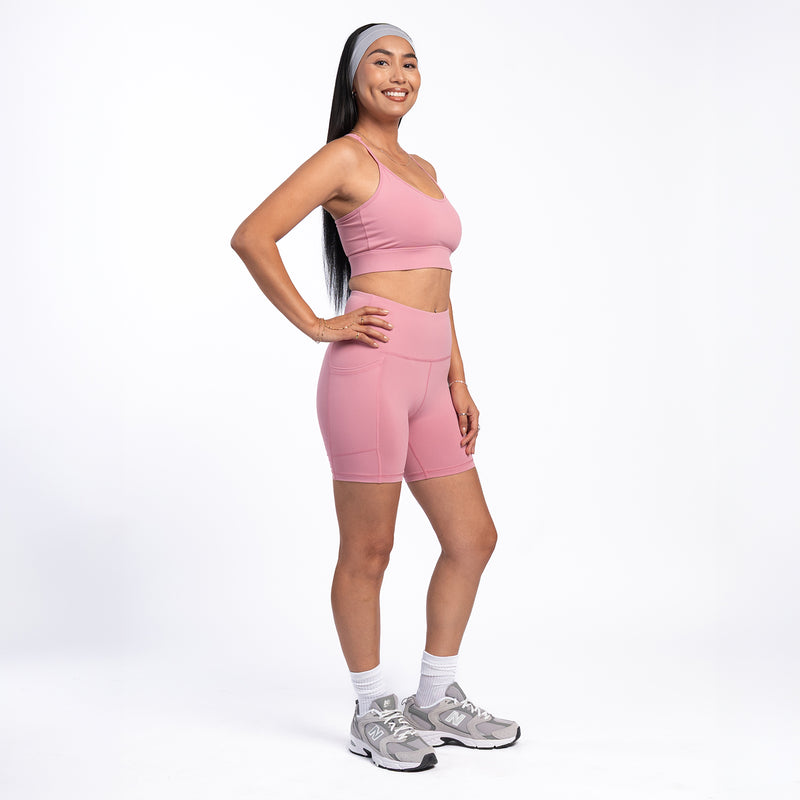 Women’s rose pink bike shorts, mid-thigh length with smooth stretch waistband