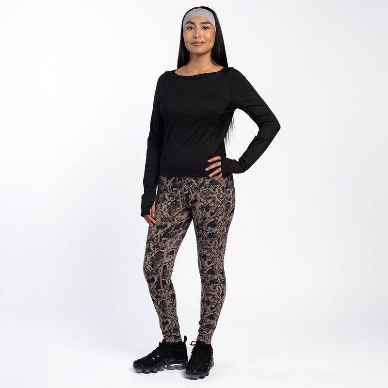 Women's snakeskin-print pocket legging, styled with black long-sleeve top.