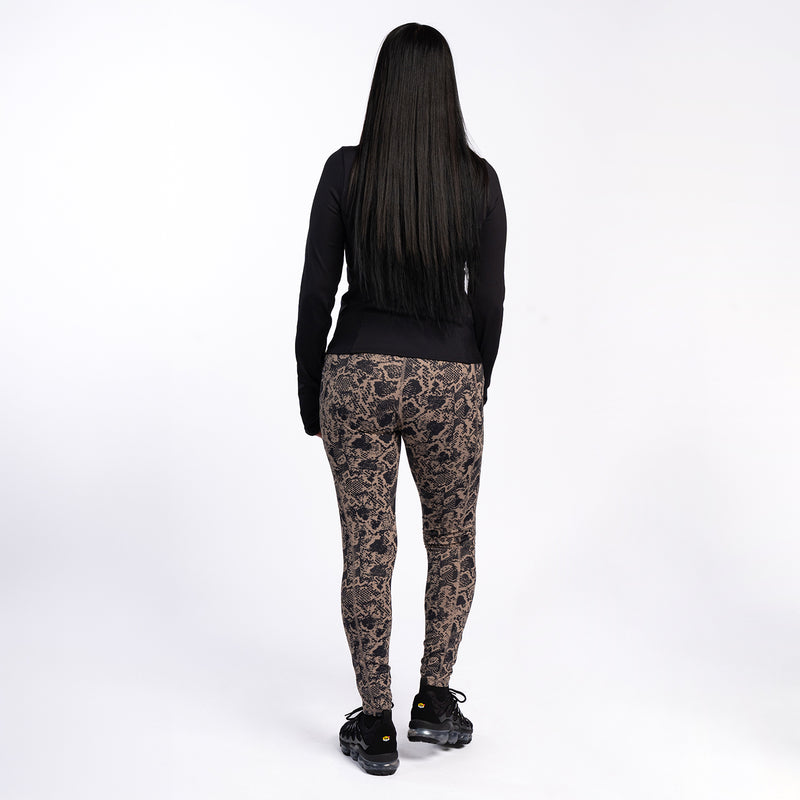 Women's snakeskin-print pocket legging, back view with black top hem.