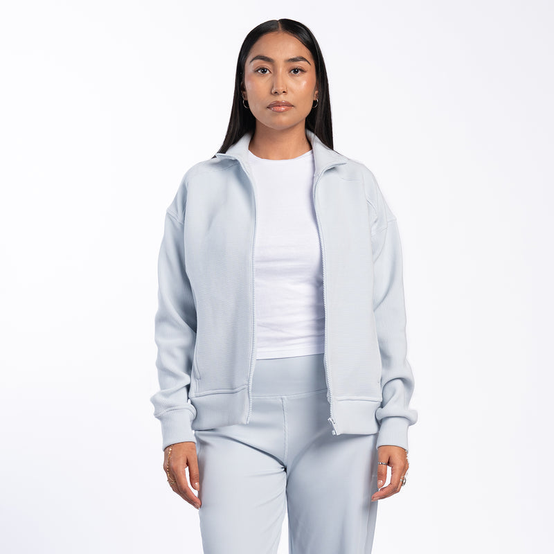 Light blue womens ribbed full-zip jacket with hood, front pocket, long sleeves