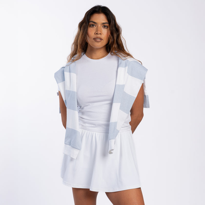 White A-line mini skirt with elastic waistband and front tie detail at the waist