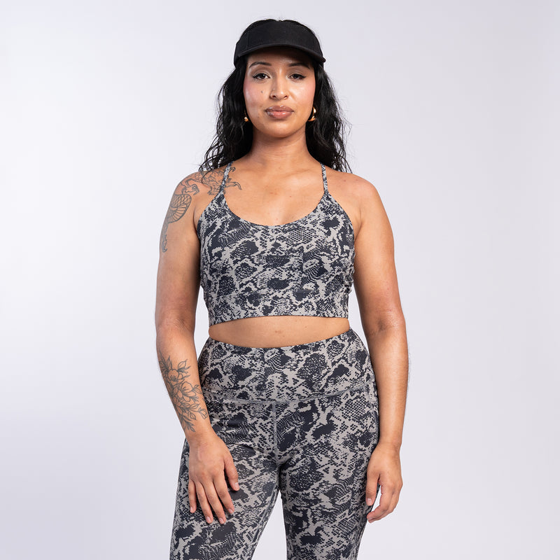 Womens snake-print sports bra with scoop neck and wide racerback-style straps